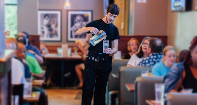 Image of waiter pouring water